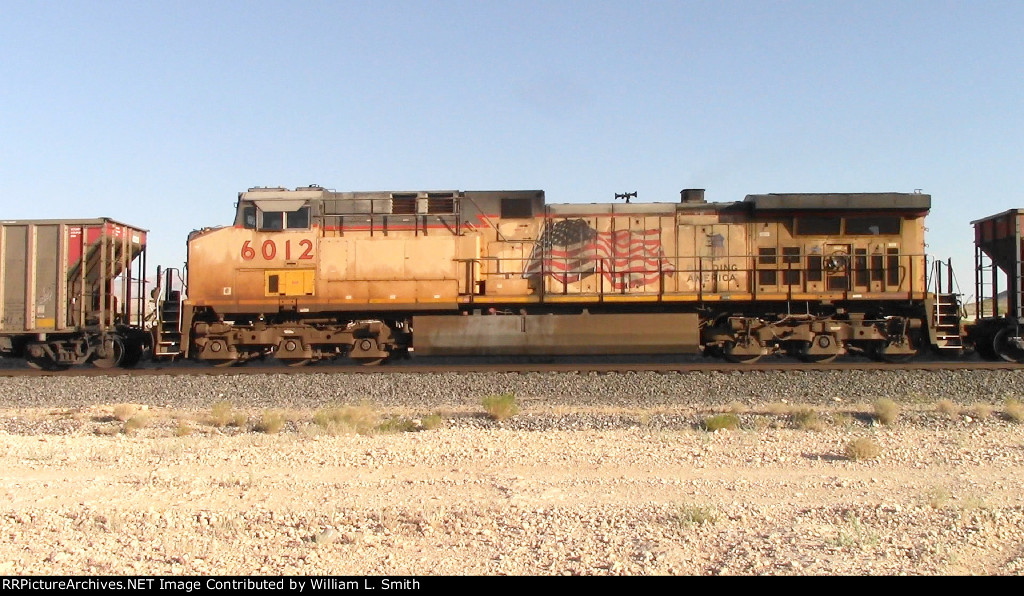 WB Unit Loaded Hooper Frt at Erie NV W-MdTrnSlv-Pshrs -85